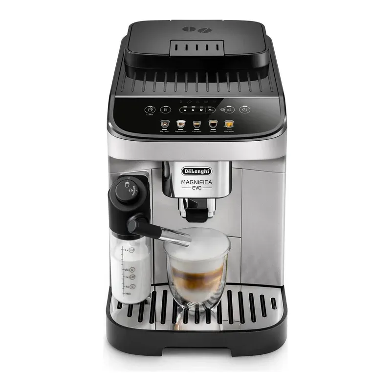 De'Longhi Magnifica Evo in silver and black with its milk carafe and a latte glass, seen from the front